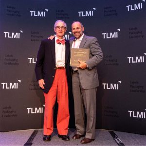 Hub Labels President, Thomas Dahbura, is presented the 2021 Elevation Sustainability Award by Calvin Frost
