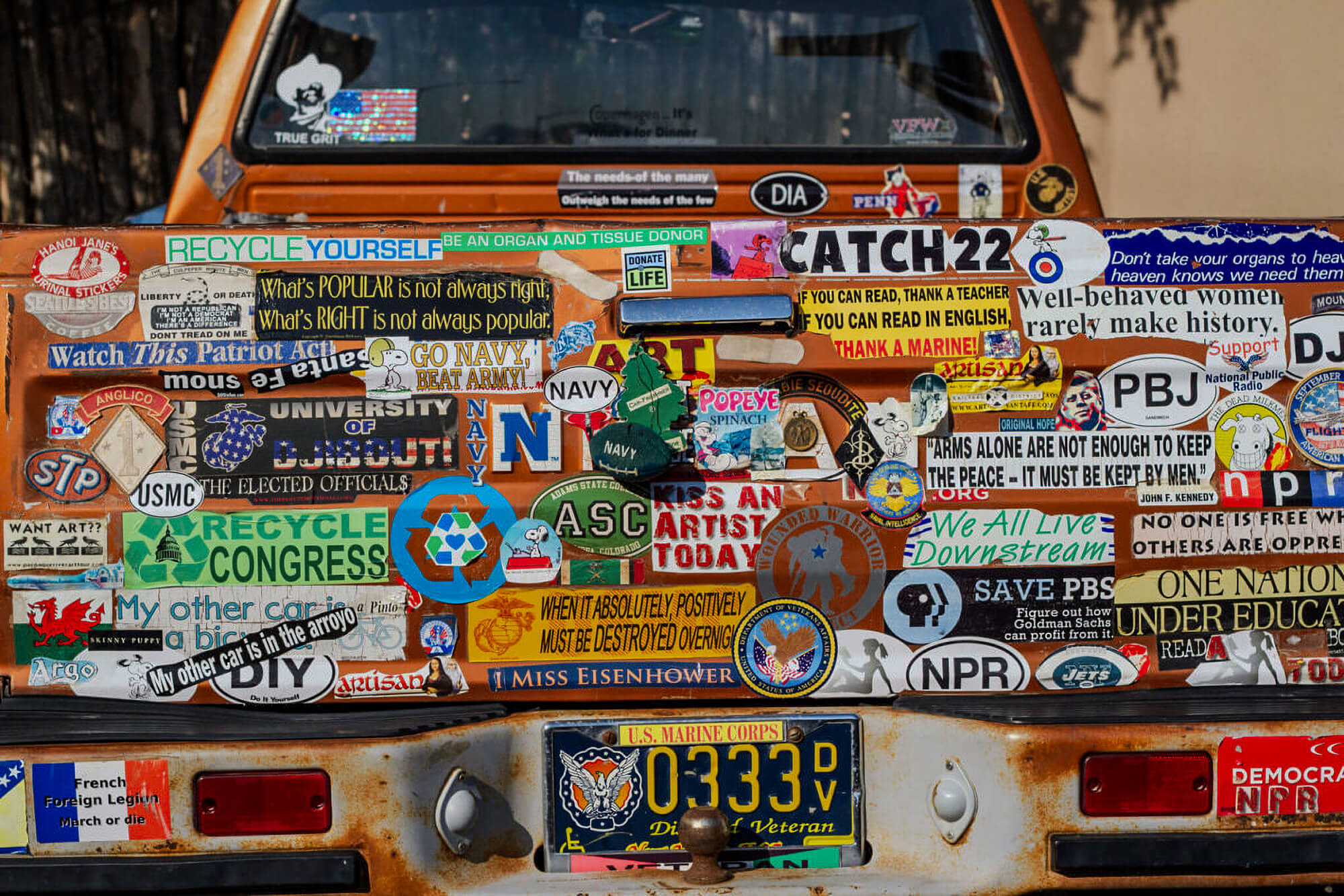 Bumper stickers on the back of a truck. Hub Labels prints and manufactures bumper stickers for direct mail campaigns.